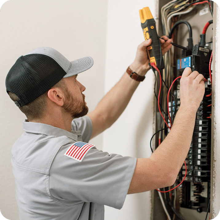 AEGIS ELECTRIC technician working on an electrical panel